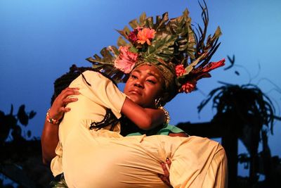 Asaka (Zhomontee Watson) carries away Ti Moune (Regina Palmer). Photo