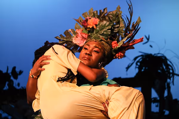 Asaka (Zhomontee Watson) carries away Ti Moune (Regina Palmer). Photo