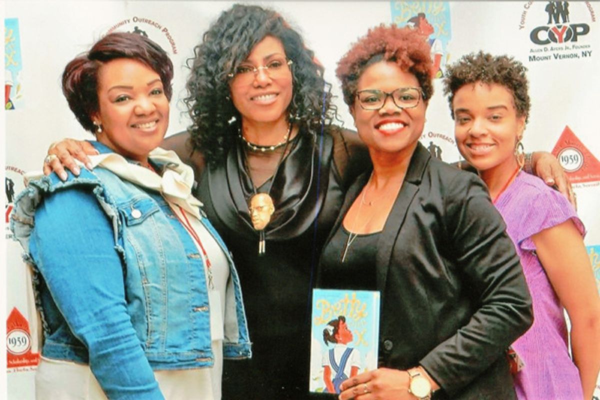 Ilyasah Shabazz (second from left), the third daughter of Malcolm X and Dr Betty Shabazz and journalist  Chasity Cooper (second from right) are greeted by Delta Sigma Theta Sorority, Incorporated., Westchester Alumnae Chapter president Danielle Henry,(lef at 