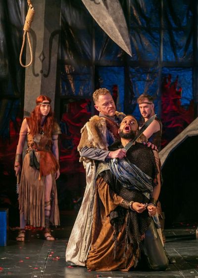 Clark Scott Carmichael as Lucius and Chris White as Aaron with the company of Titus A Photo