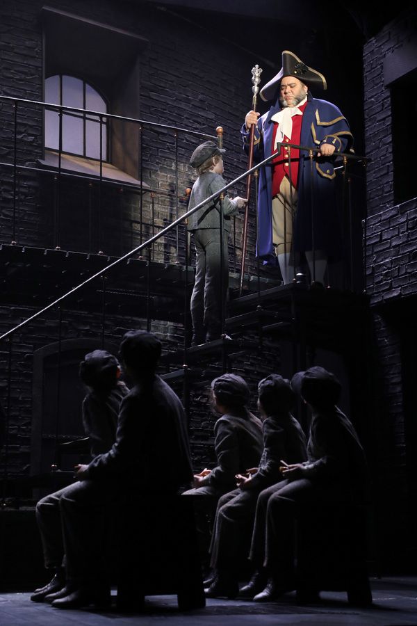 Richard Henry (Mr. Bumble) and Elijah Rayman (Oliver Twist) with the cast of Goodspee Photo