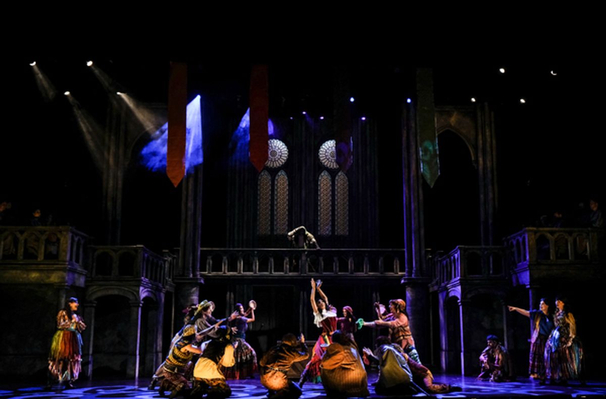  David  Burnham  (center  above)  as  Quasimodo,  Janaya  Mahealani  Jones  (center)  as  Esmeralda,  and  the  company.  at 