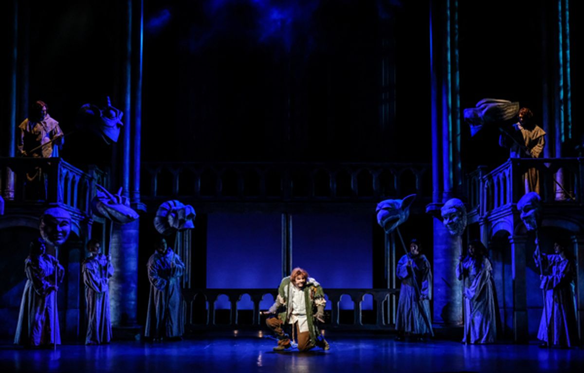  David  Burnham  (center)  as  Quasimodo  and  the  company.  at 