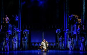  David  Burnham  (center)  as  Quasimodo  and  the  company.  Photo