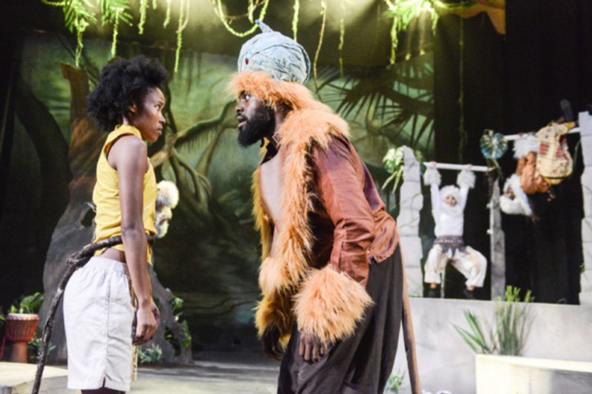 Antonia Elson as Mowgli, Joseph Black as The Monkey King and members of the company in The Jungle Book at Greenwich Theatre at 