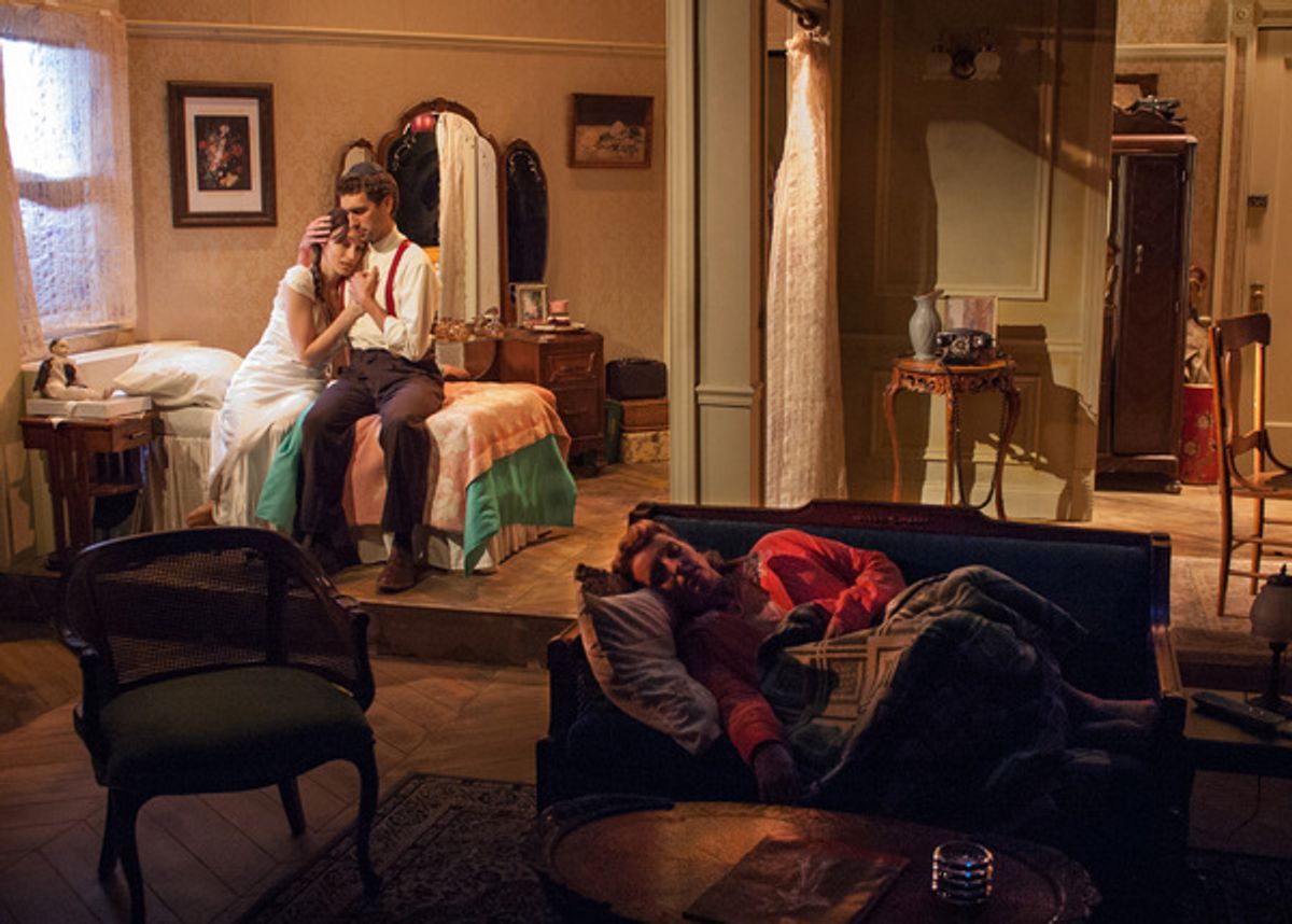 While her sister Rose (Bri Sudia, right) sleeps in the other room, Lusia (Emily Berman) dreams of reuniting with her husband Duvid (Alex Stein), whose fate she does not know since they were separated during ...

 at 