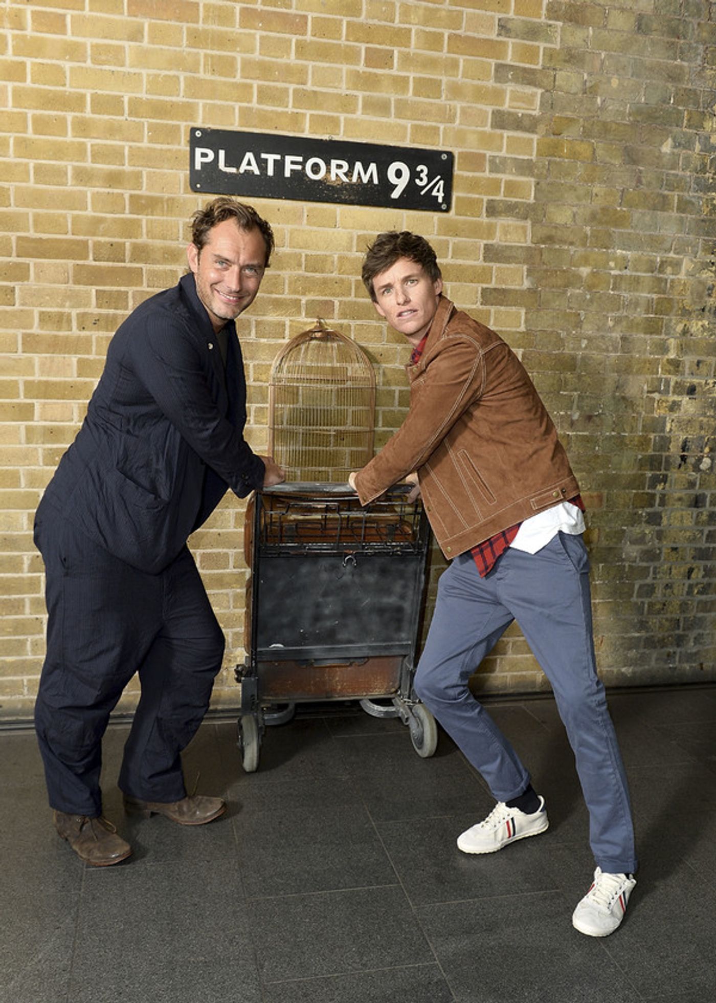 Photo Coverage: See Eddie Redmayne and Jude Law at King's Cross Station for 'Back to Hogwarts' Day  Image