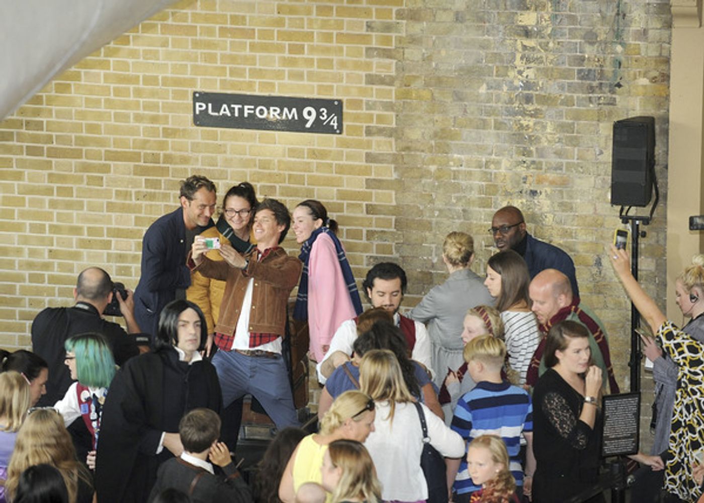 Photo Coverage: See Eddie Redmayne and Jude Law at King's Cross Station for 'Back to Hogwarts' Day  Image