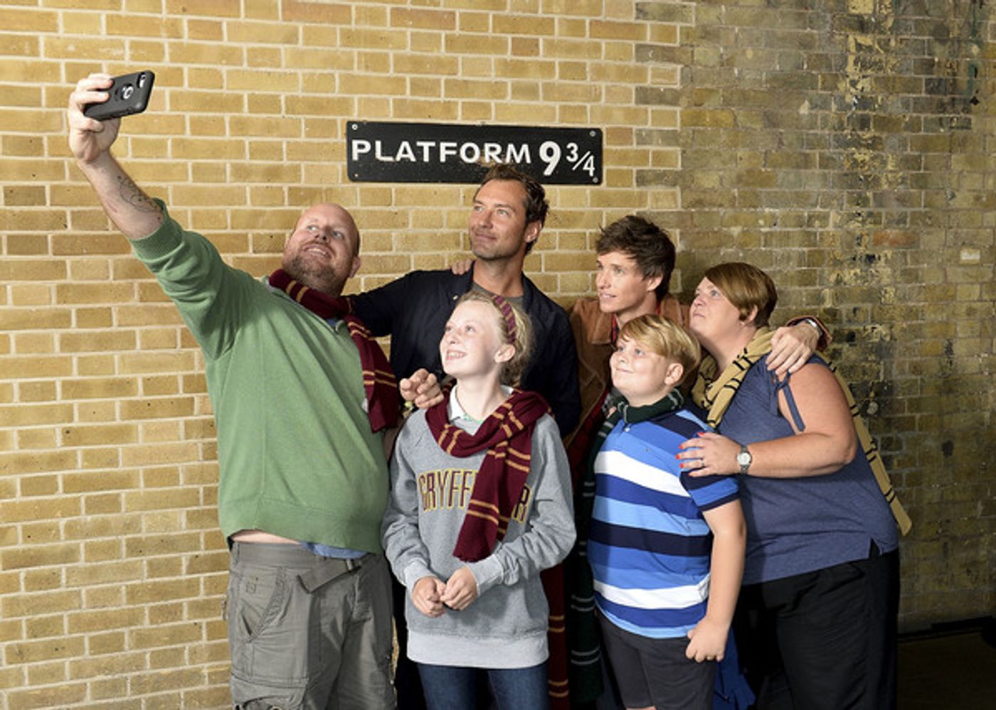 Photo Coverage: See Eddie Redmayne and Jude Law at King's Cross Station for 'Back to Hogwarts' Day  Image