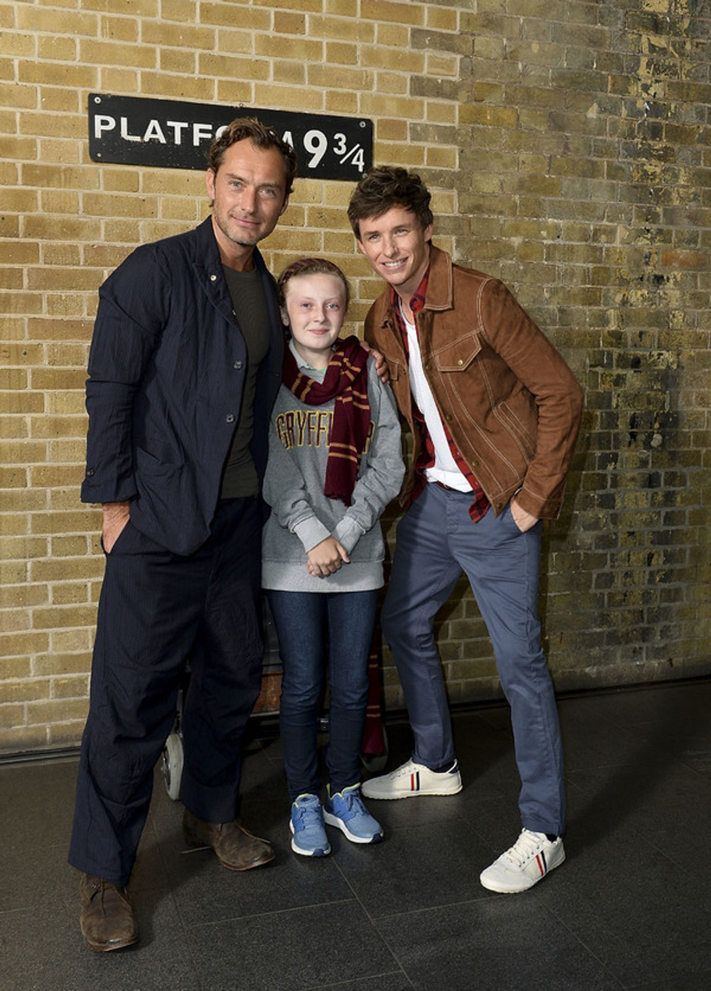 Photo Coverage: See Eddie Redmayne and Jude Law at King's Cross Station for 'Back to Hogwarts' Day  Image