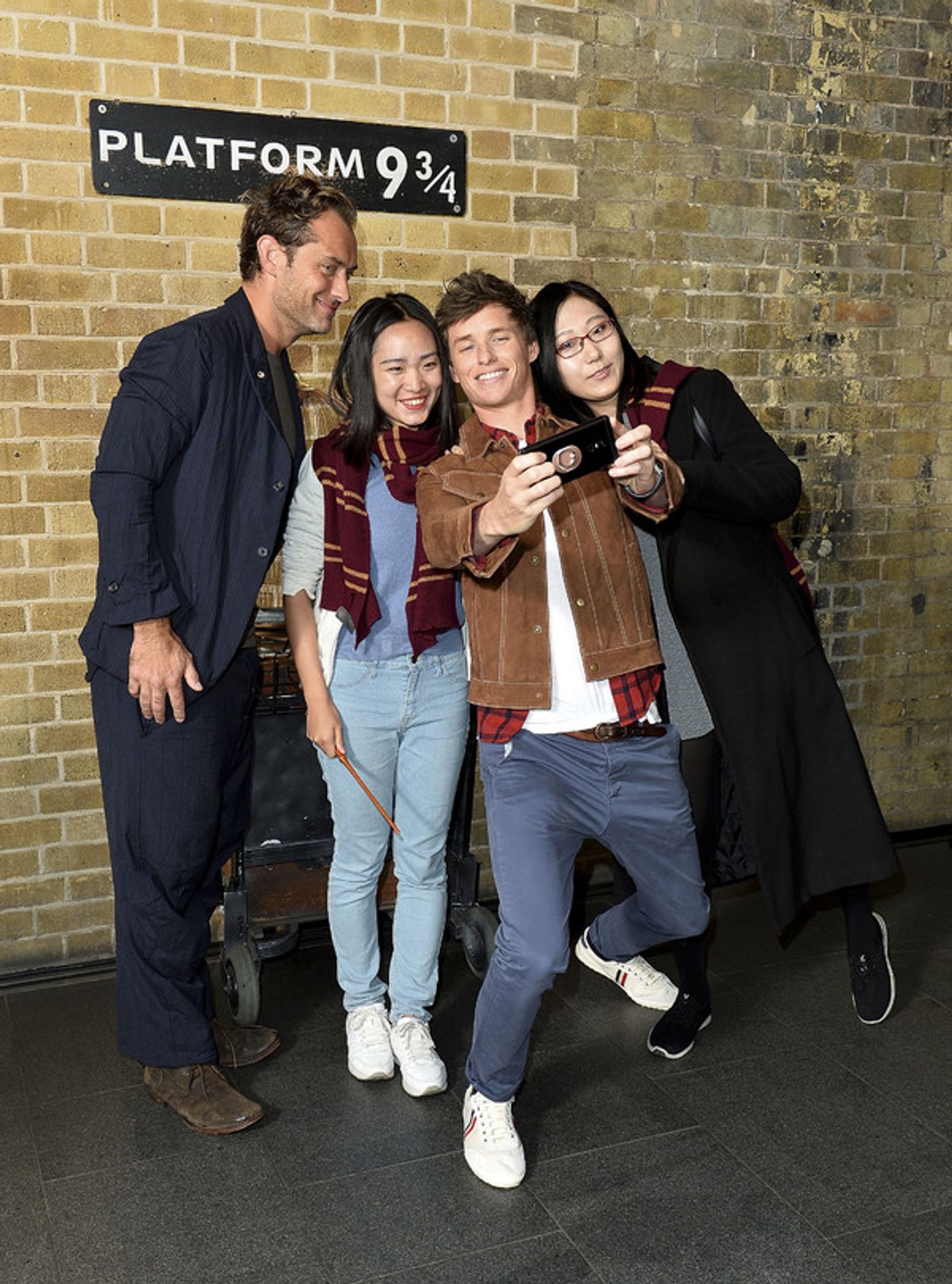 Photo Coverage: See Eddie Redmayne and Jude Law at King's Cross Station for 'Back to Hogwarts' Day  Image