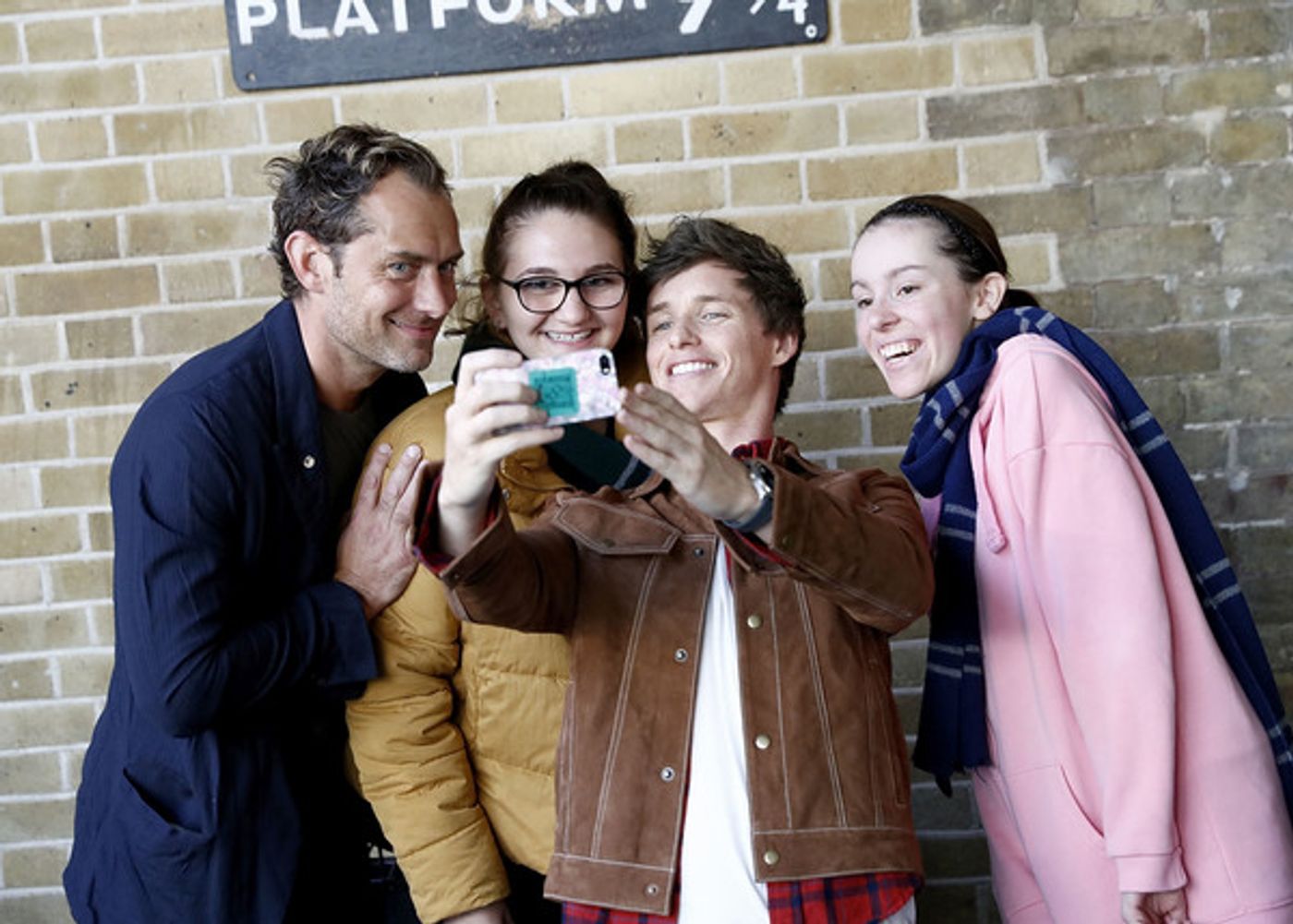 Photo Coverage: See Eddie Redmayne and Jude Law at King's Cross Station for 'Back to Hogwarts' Day  Image