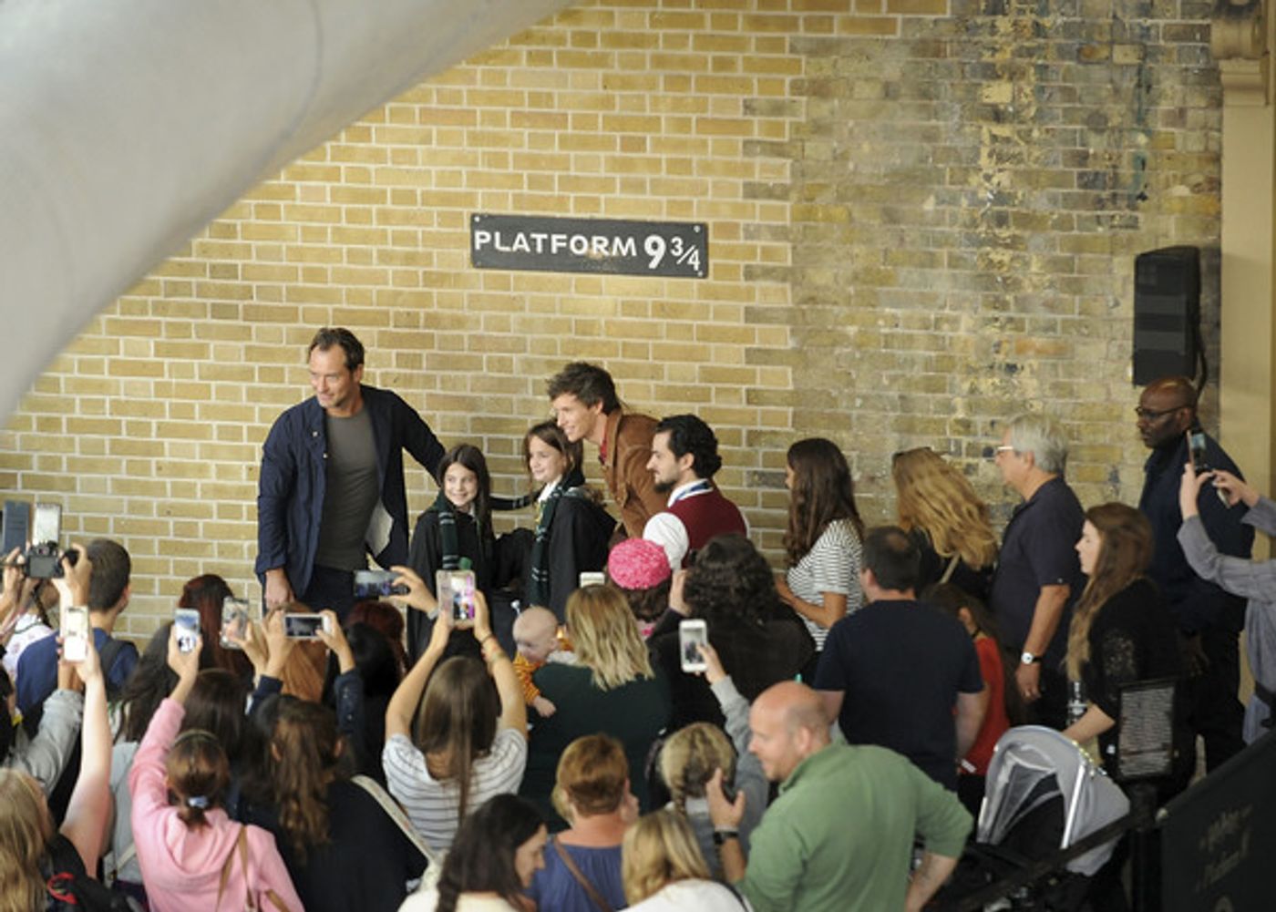 Photo Coverage: See Eddie Redmayne and Jude Law at King's Cross Station for 'Back to Hogwarts' Day  Image
