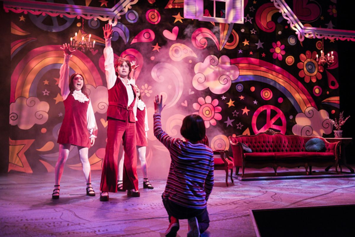 Small Alison (foreground: Lila Gold) fantasizes about her favorite TV show coming to life in her living room, complete with singers and dancers (l to r: Ayelet Firstenberg, Michael Doppe, Erin Kommor) in â€"Fun Home,â€ at 