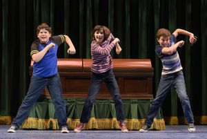 The Bechdel children (l to r: Jack Barrett, Lila Gold, and Billy Hutton) fantasize a commercial for their family-owned funeral home in â€"Fun Home,†@ BroadwayWorld The Bechdel children (l to r: Jack Barrett, Lila Gold, and Billy Hutton) fantasize a Photo