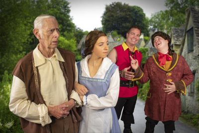 Maurice (William Walters) and Belle (Katie Conn) are mocked by Gaston (Brian Davis) a Photo