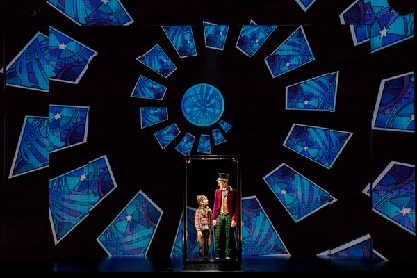 Henry Boshart as Charlie Bucket and Noah Weisberg as Willy Wonka Photo