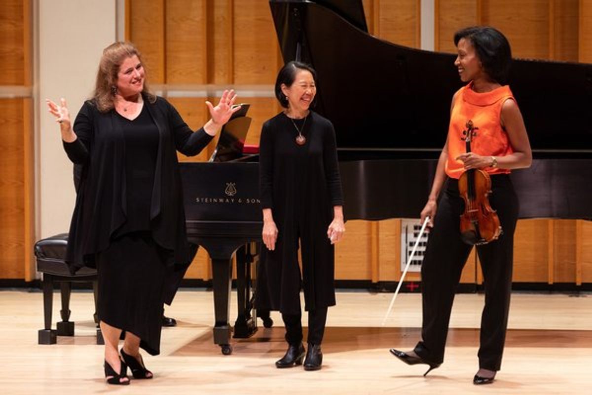 Allison Charney with violinist Kelly Hall-Tompkins and pianist Donna Weng Friedman discussing the challenges of interpreting a new work.  at 