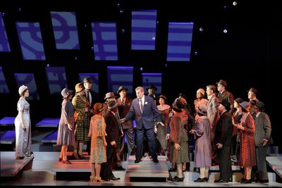 Golda Schultz as Clara (left) and William Burden as George Bailey with members of the Photo