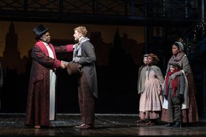 Craig Wallace as Ebenezer Scrooge, Gregory Maheu as Bob Cratchit, Yesenia Iglesias as Mrs. Cratchit and (children) Aidan Fuller, Madison K. Fields and Vaughn Mussmon @ BroadwayWorld Craig Wallace as Ebenezer Scrooge, Gregory Maheu as Bob Cratchit, Yesenia Iglesias as Photo
