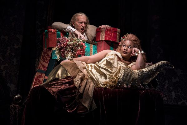 Larry Yando (Ebenezer Scrooge) and Jasmine Bracey (Ghost of Christmas Present) Photo
