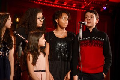 At the mike, Aidan Duver, next to Chaise Anderson, Sammie Smith, and sisters Phoebe Y Photo