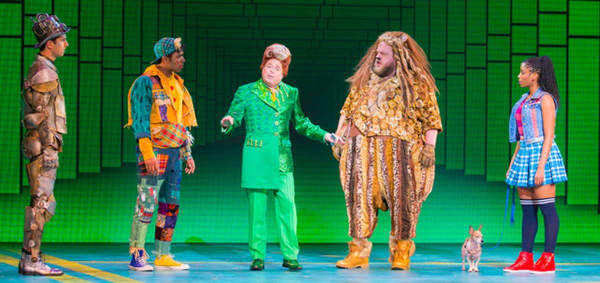 Eric Craig as Tin Man, Matt Nethersole as Scarecrow, Eddie Glen as Mr. Green, Daniel Williston as Lion, Olive as Toto, Camille Eanga-Selenge as Dorothy. Photo by Racheal McCaig at 