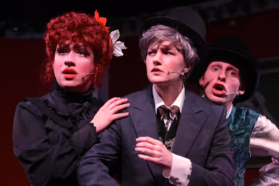 AMANDA BLAIR (Vesta Virile), SEEJAY LEWIS (Lottie Obbligato), SHANE RUDDICK ALLEN (Ch Photo
