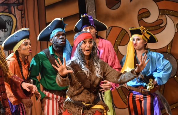 Arabella Rodrigo (centre) and member of the cast in Robinson Crusoe, Greenwich Theatr Photo
