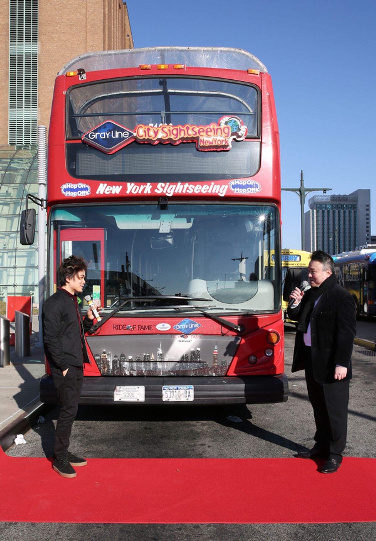 NEW YORK, NEW YORK - DECEMBER 10: Shin Lim, America's Got Talent 2018 Winner and Star of Broadway's The Illusionists, speaks with David W. Chien, Creator and Producer at Ride of Fame, during the Ride Of Fame unveiling of his imminent seat, at Pier 78 on D at 