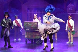 Kerry Frampton as Victor von Crepe, Rikki Chamberlain as Ms Forgetmenot and members o Photo