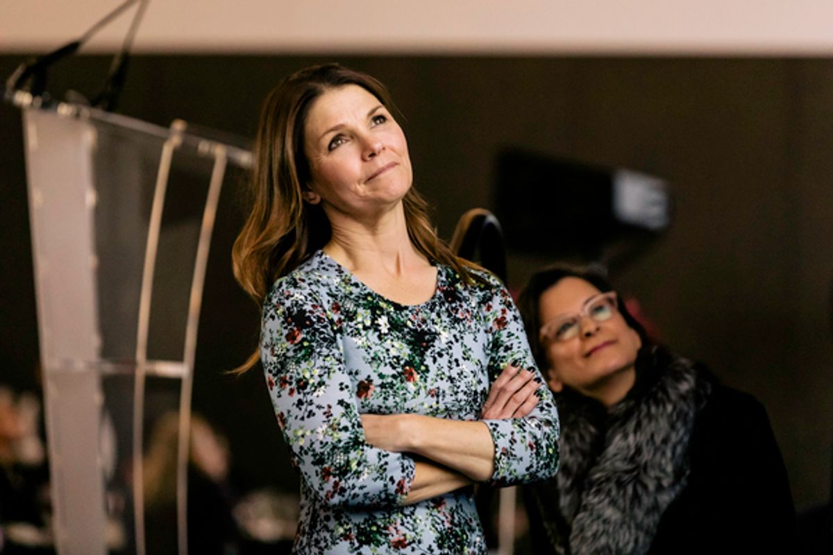Steppenwolf ensemble member Kathryn Erbe and 
Steppenwolf Artistic Director Anna D. Shapiro enjoy a video montage celebrating the past 10 years of Women in the Arts luncheons 
 at 