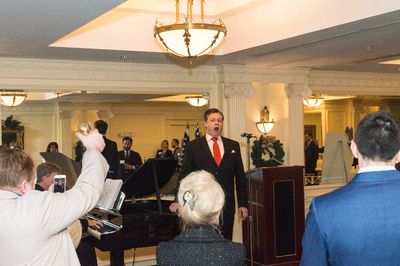 Tenor Anthony Kearns sings "God Bless America."  Photo