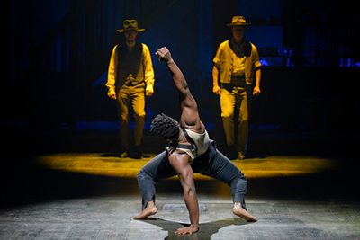  Jacobi Hall (Ensemble); (background, l to r) Garrett Colemen (Ensemble) and Jason Or Photo