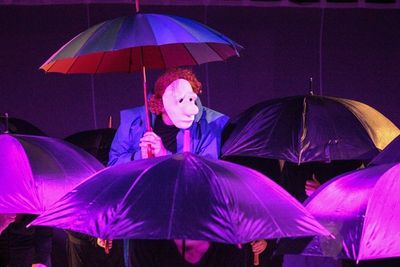 Glenn Wallis, centre, tries to find shelter from life in L'Appel Du Vide. Photo