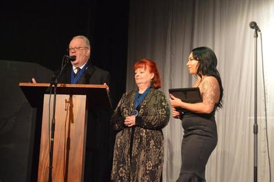 Jeffrey Ellis, Kaul Bluestone and Kiana Schofill present the award for Outstanding Th Photo