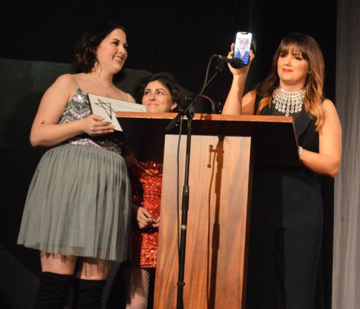 Jenna Pryor, Molly Rocket and Rachel Potter, with Broadway Princess Party's 'fairy godfairy' and musical director Benjamin Rauhala on Facetime, accepting the award for Outstanding Road Show. at 