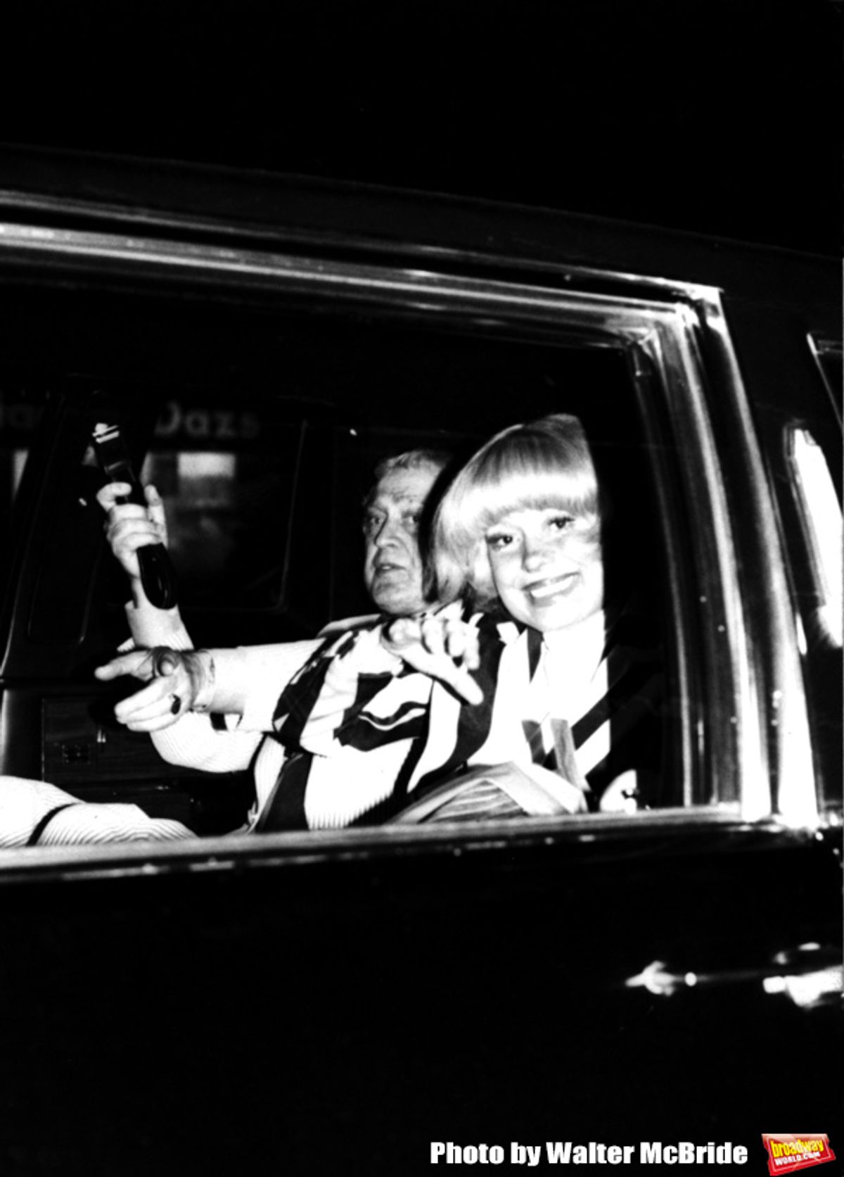 Carol Channing with her Husband leaving Sardi's Restaurant in their Car / Limo in Times Square, New York City.
September 1979 at 