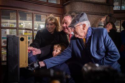 James L. Nederlander and Family light the marquee Photo