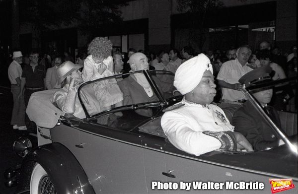 Ann Reinking, Aileen Quinn, Albert Finney and Geoffrey Holder during the filming of ' Photo