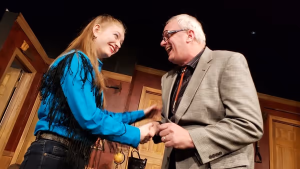 Sarah Reed as Tammy-Jo Harper and W. Richard Johnson as Mr. Oakfield, the lawyer in L Photo
