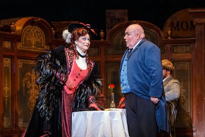 Musetta (Sari Gruber) plays coy with her sugar daddy Alcindoro (Kevin Glavin) at the  Photo