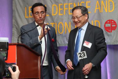 Aasif Mandvi with John G. Chou, General Counsel, AmerisourceBergen, who placed the wi Photo