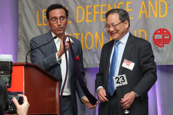 Aasif Mandvi with John G. Chou, General Counsel, AmerisourceBergen, who placed the wi Photo