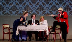 Lady Eugenia D''Ysquith (Justine Quirk) glares across the table at Lord Adalbert D''Ysquith (Edward Emmi) in the Milburn Stone Theatre?s production of ?A Gentleman?s Guide to Love & Murder? April 5-14, @ BroadwayWorld Lady Eugenia D''Ysquith (Justine Quirk) glares across the table at Lord Adalbert D''Y Photo