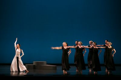 Xin Ying (soloist) and company in Martha Graham's Chronicle. Photo by Melissa Sherwoo Photo