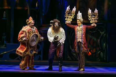 Kevin Ligon (Cogsworth), Tally Sessions (Beast), Gavin Lee (Lumiere) Photo