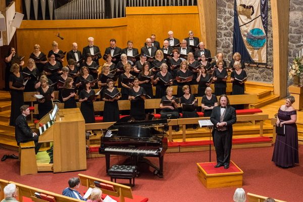Music Director Jason Tramm with members of the Morris Choral Society, guest soprano s Photo