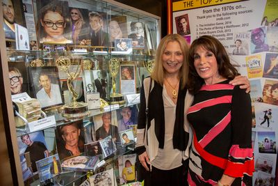 Roslyn Kind and Kate Linder with items representing Iconic LGBT Personalities Photo