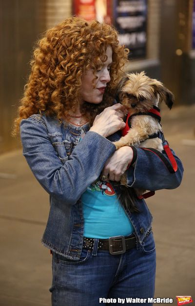 Bernadette Peters with a dog from The Humane Society of New York Photo